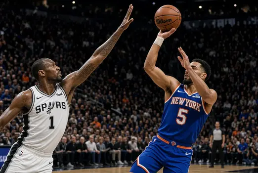San Antonio Spurs defender contesting shot against New York Knicks player in packed NBA arena
